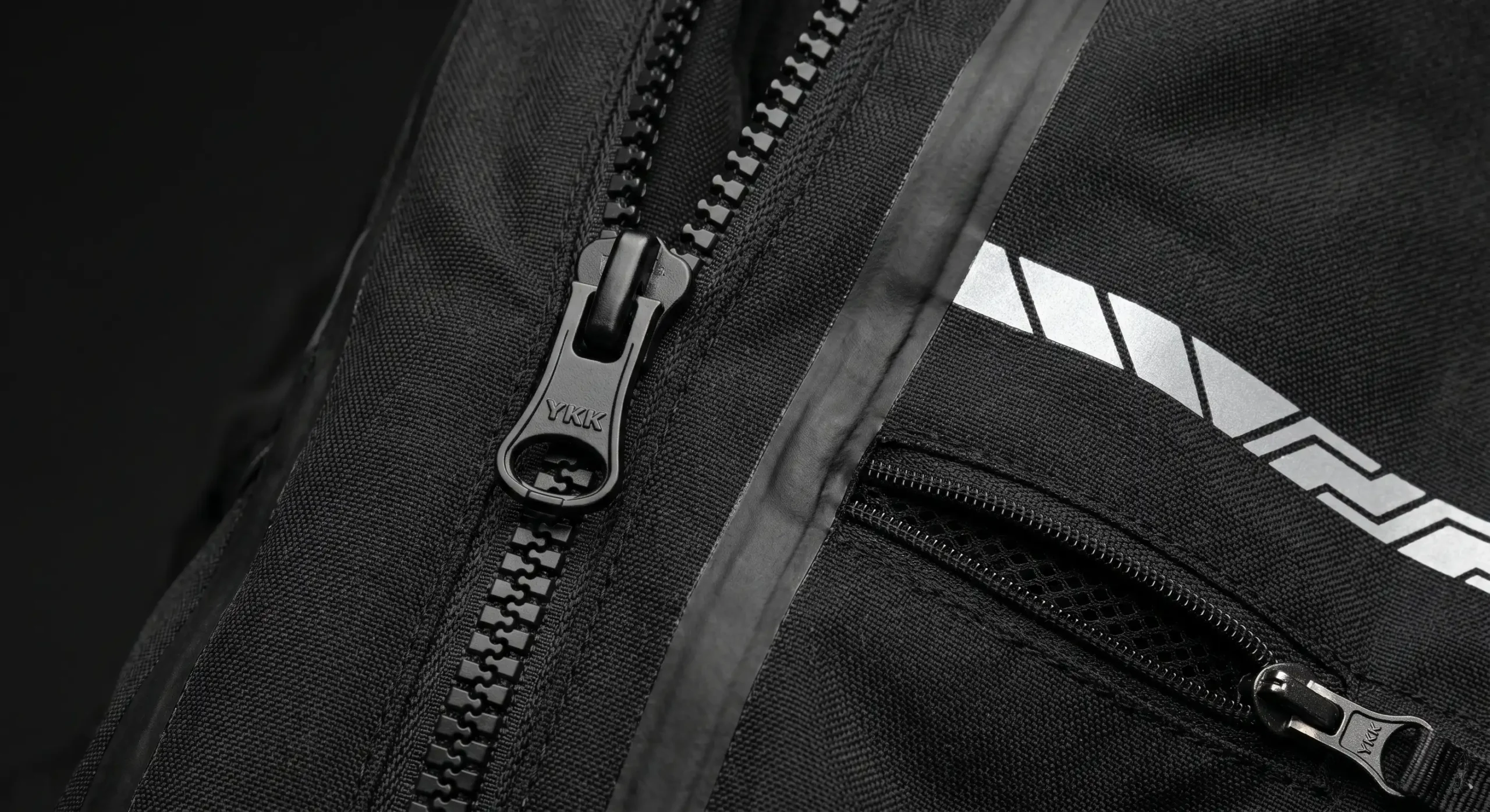 Close-up of the Oxford Mondial Advanced jacket laminate shell, vent and YKK zip